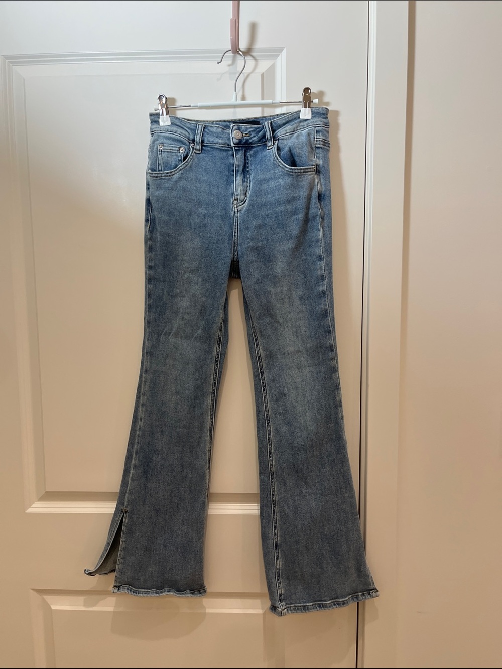 High-Rise Light Blue Flare Jeans with Hem Slit